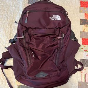Maroon North Face Surge Back pack